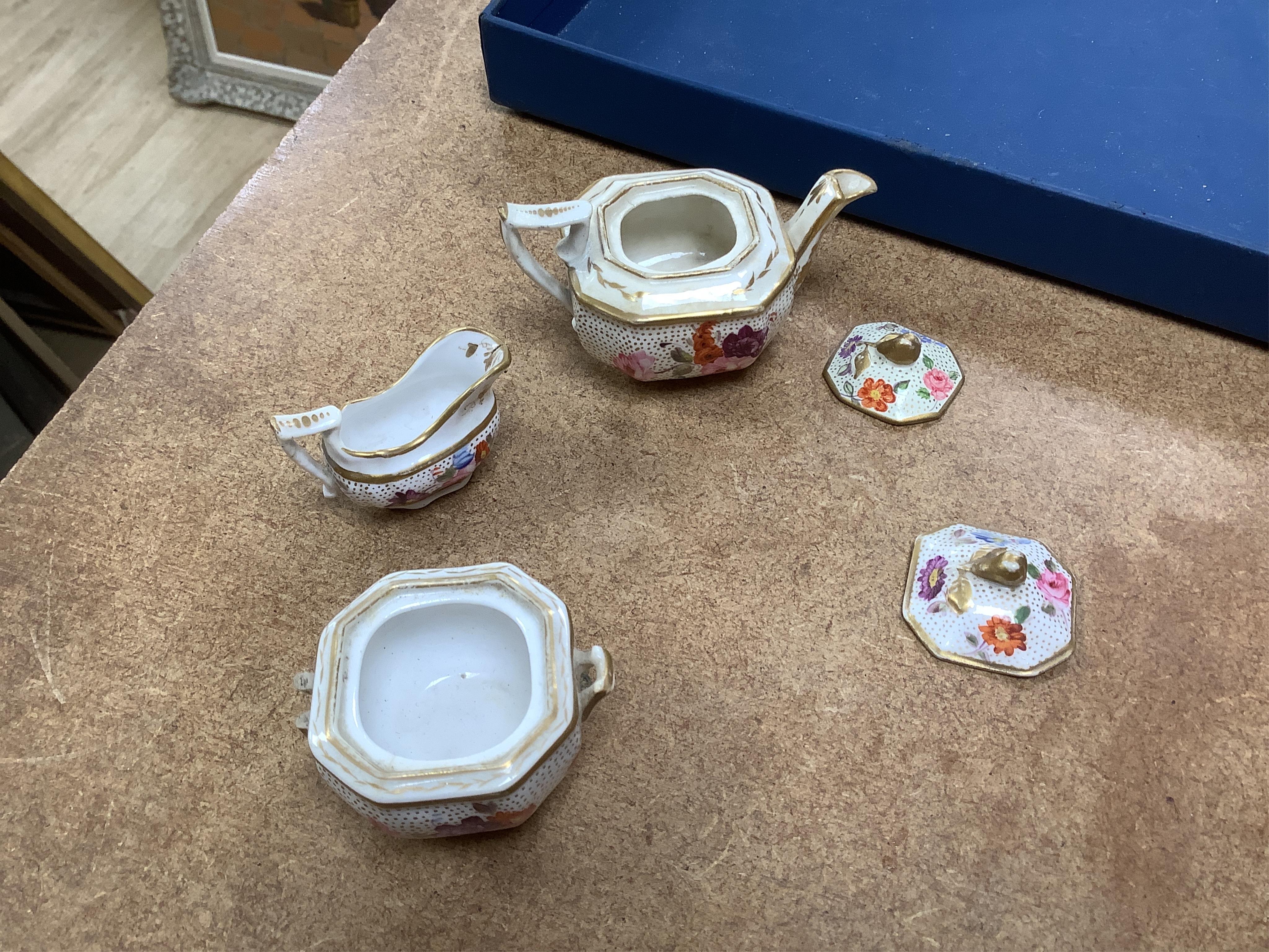 A pair of Meissen Marcolini period floral custard cups & covers together with an early 19th century English porcelain miniature tea set on tray, largest 20cm wide